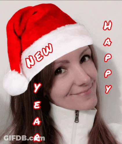Woman In Santa Hat Says New Year GIF