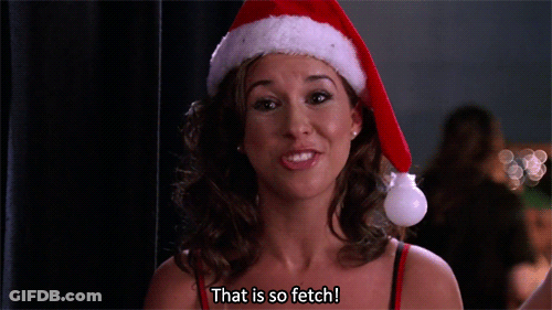 Woman In Santa Hat Smiling Says That Is So Fetch GIF