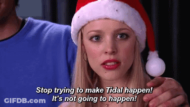 Woman In Santa Hat Talking To Man GIF