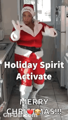 Woman In Santa Suit Dancing In Kitchen Holiday Spirit Activate Merry Christmas GIF