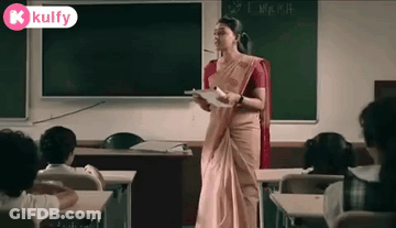 Woman In Saree Standing At Blackboard With Students GIF