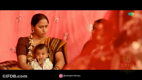 Woman In Sari Holding Baby GIF