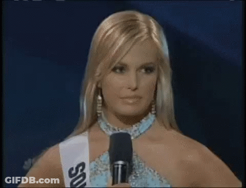 Woman In Sash Saying SSU At Microphone GIF