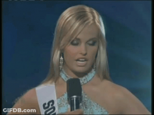 Woman In Sash Saying US Talking Into Microphone GIF
