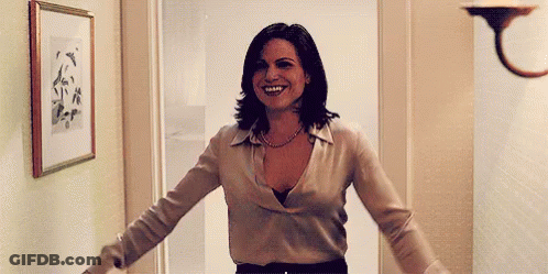Woman In Satin Blouse Standing With Arms Out GIF