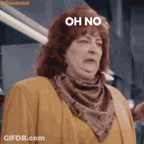 Woman In Scarf And Jacket Saying Oh No GIF