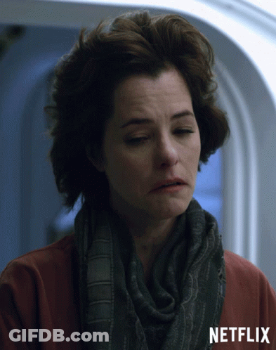 Woman In Scarf And Red Shirt With Netflix GIF
