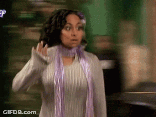 Woman In Scarf And Sweater With Disney Logo GIF