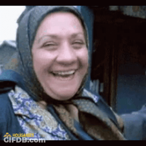 Woman In Scarf Smiling Holigan GIF