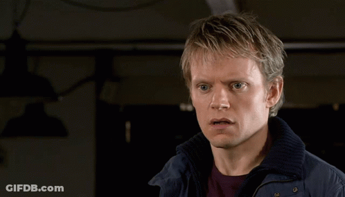 Woman In Scarf Talks To Man In Front Of Netflix Window GIF
