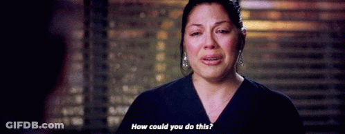 Woman In Scrub Top Crying Talking To Man GIF