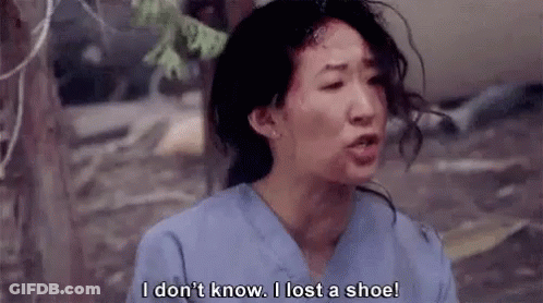 Woman In Scrubs Talking About Losing A Shoe In TV Scene GIF