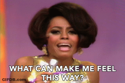 Woman In Sequined Dress Asking What Can Make Her Feel This Way GIF