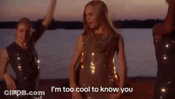 Woman In Sequined Dress Dancing On Beach GIF