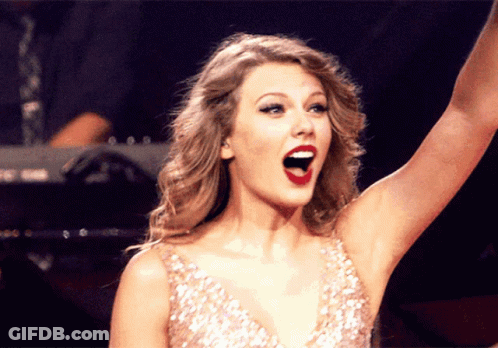 Woman In Sequined Dress Raising Arm GIF