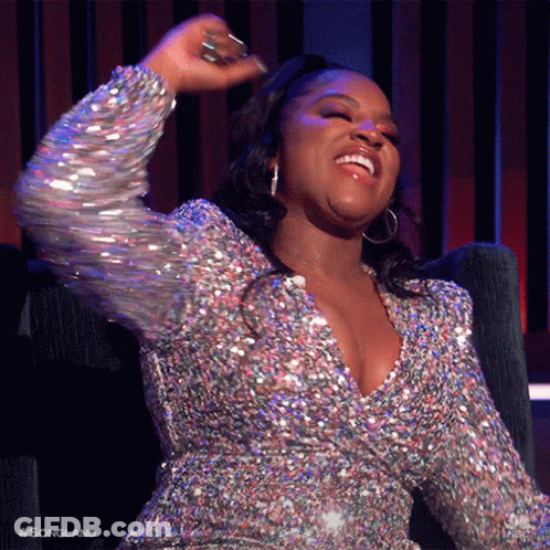 Woman In Sequined Dress Smiling Dancing GIF
