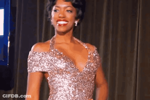 Woman In Sequined Dress Smiling GIF