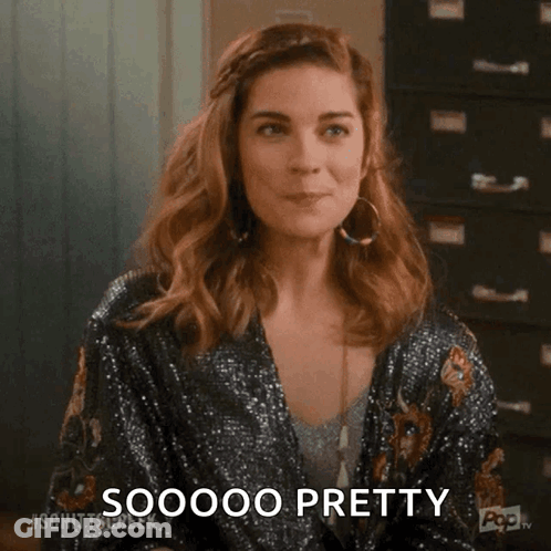 Woman In Sequined Jacket Making Funny Face GIF