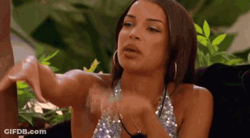 Woman In Sequined Top With Hoop Earrings And Hands Outstretched GIF