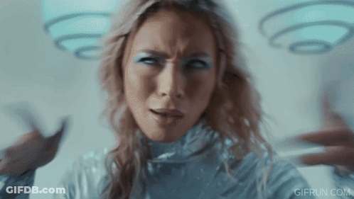 Woman In Silver Costume Making Funny Face GIF