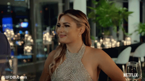 Woman In Silver Dress At Netflix Table GIF