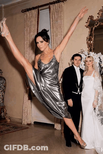 Woman In Silver Dress Doing Split GIF