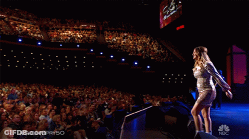 Woman In Silver Dress On NBC Stage GIF