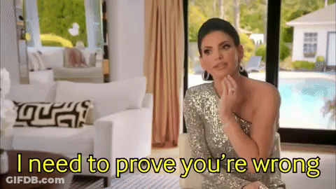 Woman In Silver Dress Saying I Need To Prove You're Wrong GIF