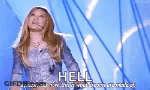 Woman In Silver Dress Says Hell Hey Now GIF