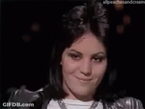 Woman In Silver Jacket Making Funny Face GIF
