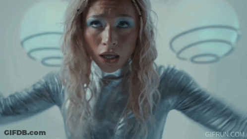 Woman In Silver Outfit With Angel Wings GIF