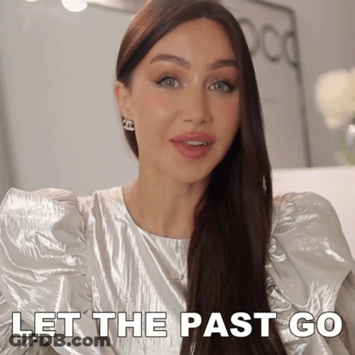 Woman In Silver Top Saying Let The Past Go GIF