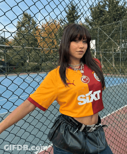 Woman In Sixt Shirt By Fence GIF