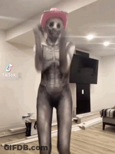 Woman In Skeleton Costume Dancing With Pink Cowboy Hat GIF