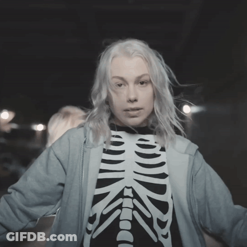 Woman In Skeleton Shirt And Blue Hoodie GIF