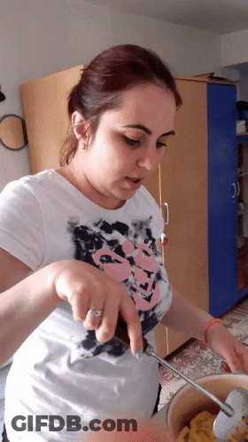 Woman In Skull Shirt Stirring Pot GIF