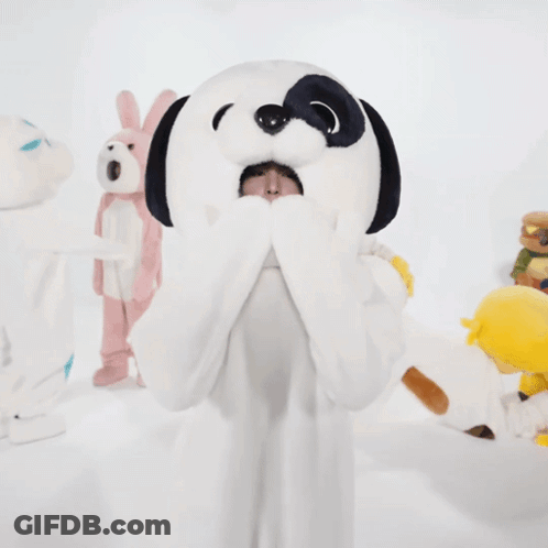 Woman In Snoopy Costume With Stuffed Animal On Head GIF