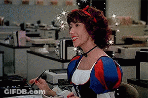 Woman In Snow White Costume Sitting At Desk With Pen GIF