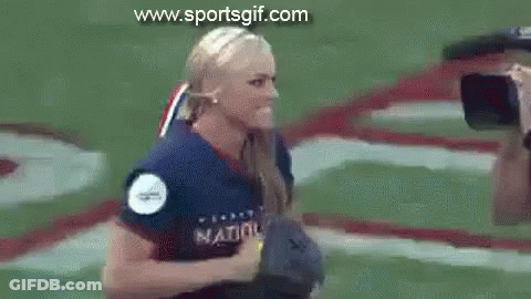 Woman In Softball Uniform Holding Yellow Ball GIF