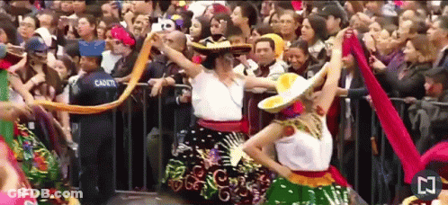 Woman In Sombrero Dancing With Cadet GIF