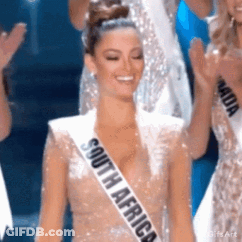 Woman In South Africa Sash Smiling On Stage GIF
