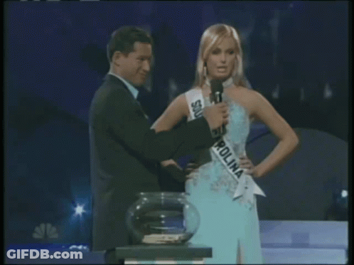 Woman In South Carolina Sash Beside Man GIF