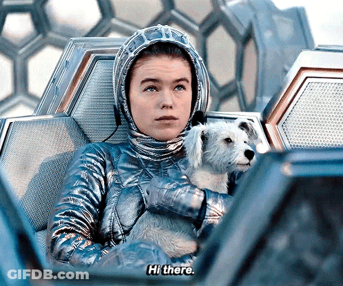 Woman In Space Suit Holding Dog Says Hi There GIF