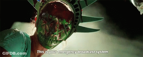 Woman In Statue Of Liberty Mask Says This Is Your Emergency Broadcast System GIF