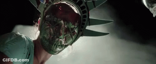 Woman In Statue Of Liberty Mask With Blood From Mouth GIF