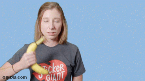 Woman In Sticker Giant Shirt Holding Banana GIF