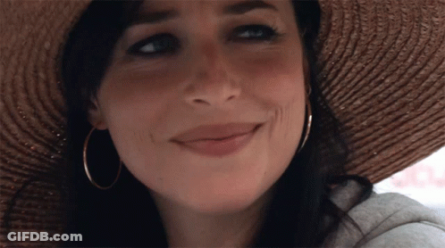 Woman In Straw Hat And Hoop Earrings Smiling GIF