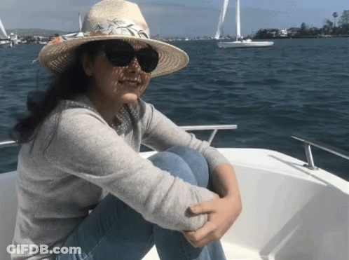 Woman In Straw Hat And Sunglasses On Boat GIF