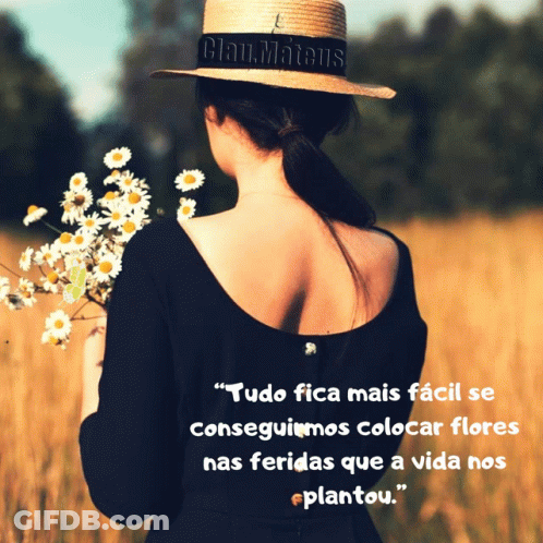 Woman In Straw Hat Holding Daisies In Field GIF