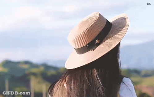 Woman In Straw Hat With Black Ribbon GIF